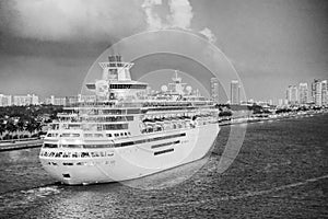 Cruise ship or liner at dusk ready to depart from Miami port on a beautiful sunset