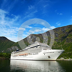 Cruise ship in norvegian fjiord photo