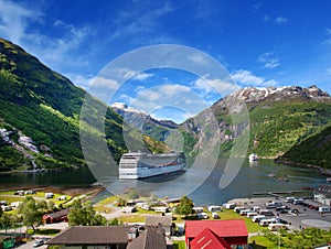 Cruise ship in norvegian fjiord photo