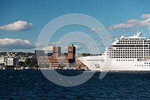 Cruise ship in Oslo fjord with City Hall