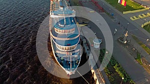 Cruise ship at the pier at sunset. Tourism. Aerial footage