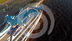 Cruise ship at the pier at sunset. Tourism. Aerial footage