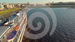 Cruise ship at the pier at sunset. Tourism. Aerial footage