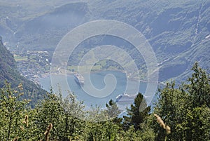 cruise ship in the popular and scenic fjord of Geiranger in Norway