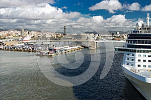 Cruise ship in the port with cityscape on background of Barcelona. Spaine.