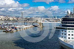 Cruise ship in the port with cityscape on background of Barcelona. Spaine.