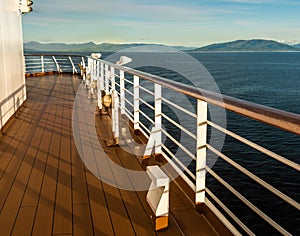 Cruise ship Port deck and railing in late afternoon, Inside Passage, BC, Canada.