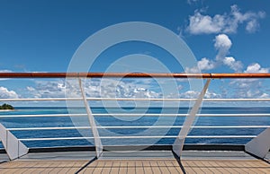 Cruise ship railing with sea view.