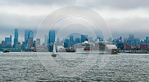 Cruise ship Regent Navigator sailing next Manhattan in New York. Skyline of New York Manhattan cruising on the Hudson