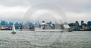 Cruise ship sailing next Manhattan in New York. Skyline of New York Manhattan cruising on the Hudson River cruise liner