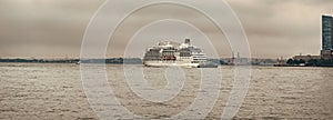 Cruise ship sailing next Manhattan in New York. Skyline of New York Manhattan cruising on the Hudson River cruise liner