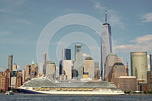 Cruise ship sailing next Manhattan in New York. Skyline of New York Manhattan cruising on the Hudson River cruise liner