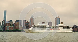 Cruise ship sailing next Manhattan in New York. Skyline of New York Manhattan cruising on the Hudson River cruise liner