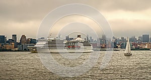 Cruise ship sailing next Manhattan in New York. Skyline of New York Manhattan cruising on the Hudson River cruise liner