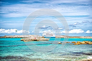 Cruise ship in sea in Great stirrup cay, Bahamas on sunny day. Ocean liner in turquoise water on blue sky. Summer vacation on cari