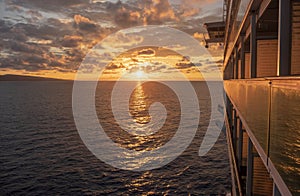 Cruise ship at sea with sun setting