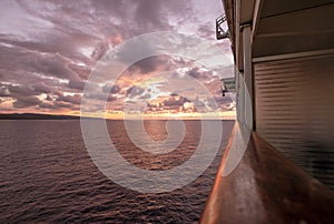 Cruise ship at sea with sun setting