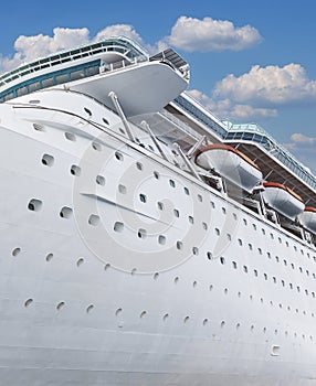 Cruise ship side view with blue sky. Vacation on ocean liner concept