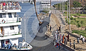 Cruise ship with tourists and merchants at the rive Nile