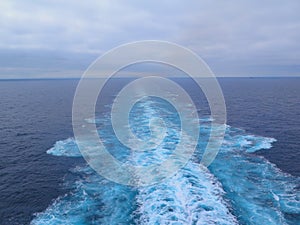 Cruise ship track on the water. Seaside landscape with water, sky and horizon.