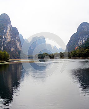 Cruise ship travels the route along the Li river from Guilin to Yangshou.