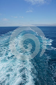 A Cruise ship wake on a beautiful sunny day