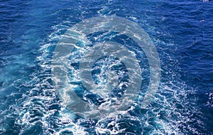 Cruise ship wake or trail on ocean surface, white trace