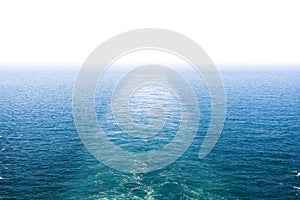 Cruise ship wake or trail on ocean surface, white trace