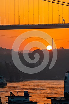 A cruise ship on the Yangtze River under the shining glow of the sunrise passes Cuntan Port