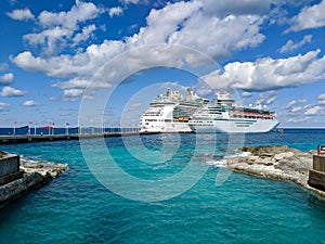 Cruise Ships Docked in Port with Blue Skies and Water
