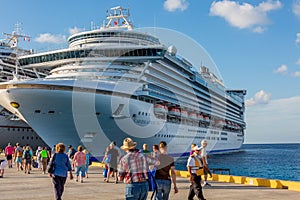 Passengers walking to and from Cruise Ships In Port