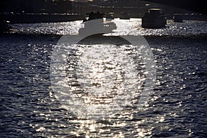 Cruise ships sail on the Moscow river at a sunny day.