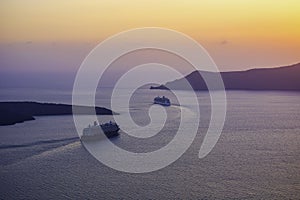 Cruise ships set sail during sunset near the Greek islands