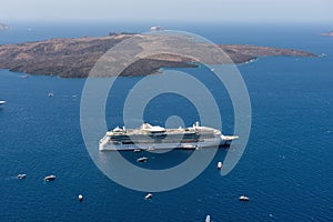 Cruise ships are staying moored in volcanic caldera of Santorini island, Greece