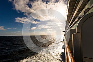 Cruise traverses sea in sun rays