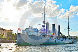 The cruiser Aurora at the Nakhimov naval school in Petrograd embankment of the river Bolshaya Nevka in the sun photo