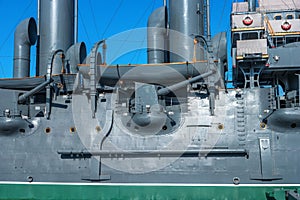 The Cruiser Aurora. St. Petersburg, Russia. Fragment of the side of the ship. You can see the weapon, the lifeboat. The