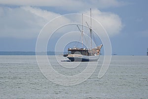 A cruiser ship mooring at the sea for Raja Ampat tourism purpose.