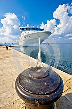 Cruiser ship tied on mooring bollard