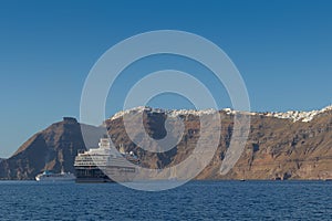 Cruises anchored next to Fira, Santorini. Greece.