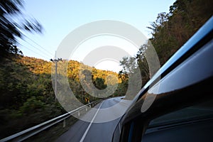 Cruising the countryside in a blue car at high speed