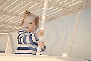 Cruising with kids. Child smiling face striped shirt looks like sailor. Kid boy toddler travelling sea cruise. Family