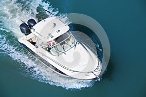 Cruising motor boat with two motors aerial photo