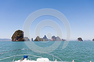 Cruising on a motorboat through the limestone islands of Phang Nga Bay, Phuket, Thailand