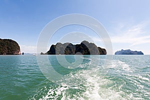 Cruising on a motorboat through the limestone islands of Phang Nga Bay, Phuket, Thailand