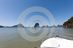 Cruising on a motorboat through the limestone islands of Phang Nga Bay, Phuket, Thailand