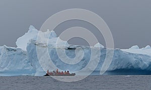 Cruising past a large iceberg in Antarctica