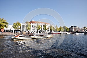 Cruising on the river Amstel Amsterdam Netherlands photo