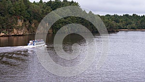 Cruising the scenic river, boat tour. Landscape, summertime,  cloudy day. Wisconsin river, Wisconsin Dells