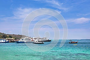 Cruising ships and boats moored in andaman sea at Phi Phi Don island , Thailand